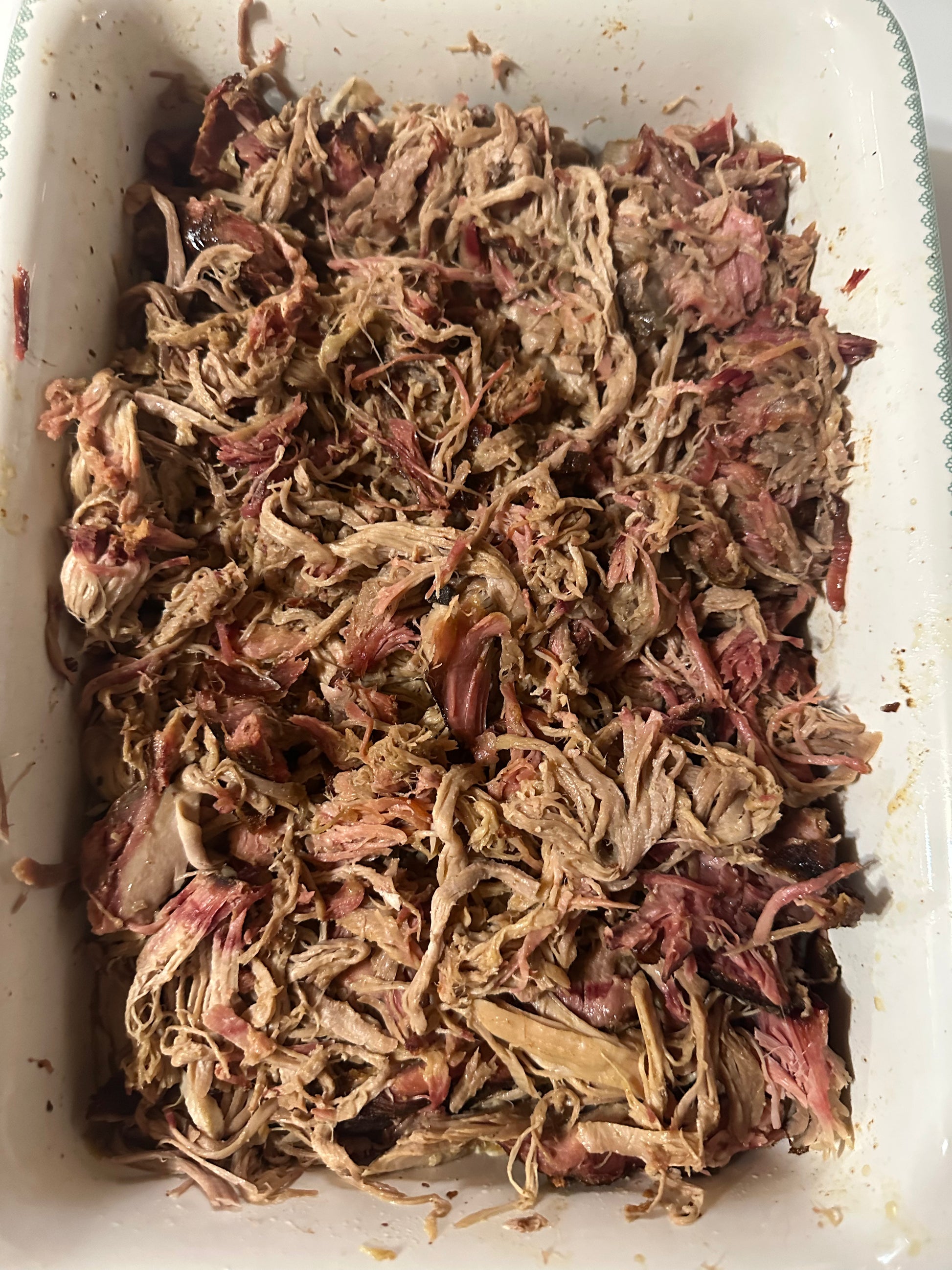 Shredded meat in a white container