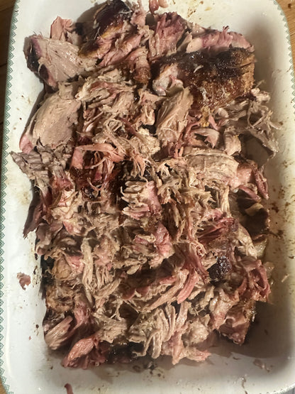 Shredded beef in a white container